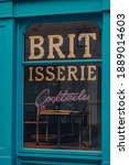 Small photo of London, UK - November 19, 2020: Close up Britisserie sign on a window of closed Epic Pies, a traditional pie shop on Addle Hills in St. Pauls industrial chic surrounds.
