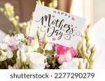 Small photo of flower composition of light roses and eustoma closeup. Text Happy mother's day. Bright bouquet with tender flowers.Greetings card,sweet wish concept.