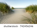 Beach With Sand Dunes And...