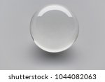 closeup view of industrial  glass ball bearing isolated on light  grey background