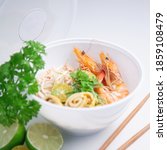 Small photo of Sarawak Laksa, a spicy noodle dish famous and unique to the state of Sarawak in Malaysia.Traditional Sarawak laksa is a famous Sarawak noodle dish which looks like the normal curry laksa.