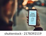 Small photo of Woman buying ticket online at bus stop before ride. Person paying for ticket using mobile payment app. Using technology on the go. Order confirmation on mobile screen. Top up account in app. Bus stop