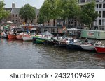 Small photo of Boats Lying On The Amstel Rive Awaiting For The Gaypride At Amsterdam The Netherlands 5-8-2023