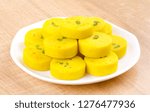 Small photo of Indian Sweet Food Kesar Peda Also Know as Kesar Mawa Peda, Saffron Sweet, Saffron Peda, Pedha, Pera or Peday is a Saffron Flavoured Soft, Dense Sweet That is Specially Made During Festivals