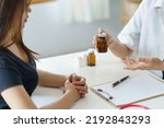Small photo of Doctor records the patient's history. treatment record describe the effects of disease and medications, side effects, medications, and self-care methods.