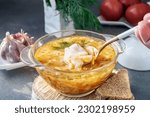 Small photo of Soup is a traditional Russian soup. Cabbage, potato and meat soup in a transparent glass tureen. Traditional Russian and Ukrainian cuisine.