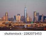 Small photo of Airplane of airlines is going on taxiway after landing in Newark airport the USA. Aircraft on background of New York