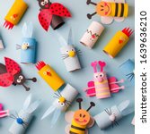 Small photo of Happy easter kindergarten decoration concept - rabbit, chicken, egg, bee from toilet paper roll tube. Simple diy creative idea. Eco-friendly reuse recycle decor, daycare paper craft