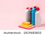 Chemical poisoned cleaning supplies bottles isolated on pink pastel background. Hard shadow, trendy shot, copy space for your adds, cleaning service flyer, coupon, banner