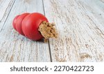 Red dog toy on a wooden...