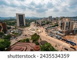 Small photo of YAOUNDE, CAMEROON - June 6, 2022: View from the city center showing the famous roundabout with 'I Love My Country Cameroon' sign.