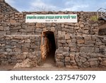 Tunnel trench from the time of the Yom Kippur War on the Golan Heights, Israel. The sign translates to: A site in honor of the values of brotherhood, heroism, and the bond of warriors
