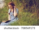 Young Romantic Woman Reading A...