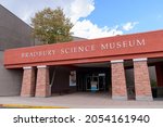 Small photo of Bradbury Science Museum sign on the facade of chief public facility of Los Alamos National Laboratory - Los Alamos, New Mexico, USA - 2021