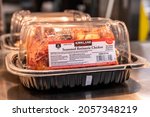 Small photo of Los Angeles, CA,USA, October 12th 2021, Kirkland brand seasoned rotisserie chickens for sale at a Costco Mega Discount Store