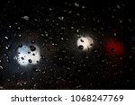 Small photo of blurred and jittery glass pane with raindrodops on the outside a