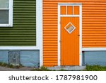 An Orange Wooden Exterior Door...