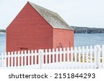 A Small Vibrant Red Wooden Barn ...