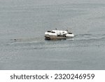 Small photo of St. John's, Newfoundland, Canada- OceanGate-May 29, 2023: Polar Prince towing OceanGate Expeditions submersible vessels on a barge as it leaves for the Titanic wreck site to tour below the ocean.