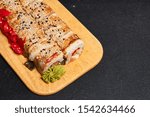 Small photo of Sushi set. Sushi set on dark background. Japanese sushi.