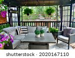 Sheltered outdoor summer lanai seating for relaxing warm days in backyard or on vacation