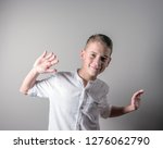 smiling cute boy in a white... | Shutterstock . vector #1276062790