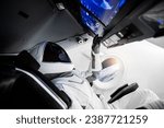 Astronaut on a spaceship flying in outer space. Elements of this image furnished by NASA.