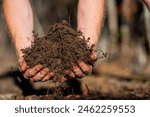 Farmer hold soil in hands...