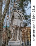 Small photo of Madrid, Spain - January 4, 2018 : Limestone statue of Visigothic King Don Pelayo Pelayo, Pelagius or Belai al-Rumi). Located in the Plaza de Oriente square downtown Madrid in front of Royal palace