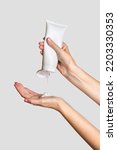 Small photo of Woman pouring lotion into hand. Cosmetic product branding mockup. Daily skincare and body care routine. Female hand holding cosmetic product mockup, close up.