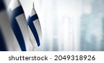 small flags of finland on a... | Shutterstock . vector #2049318926