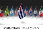 The national flag of the Cuba on the background of flags of other countries