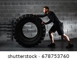crossfit training - man flipping tire