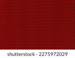 Background of wavy red metallic grid with holes. Metal mesh as background. Perforated metal back. 