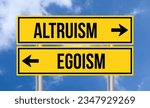 Small photo of Altruism or egoism road sign on cloudy sky background
