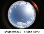 image of blue sky with clouds, circle effect from fisheye lens