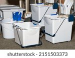 Small photo of Plastic buckets buckets with wringer, frame, mop as part of a professional cleaning system for small areas for quick and ergonomic cleaning of rooms with high performance.