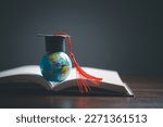 Small photo of Graduation cap with Earth globe. Concept of global business study, abroad educational, Back to School. Education in Global world, Study abroad business in universities in worldwide. language study
