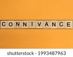 Small photo of gray word connivance made of wooden square letters on brown background