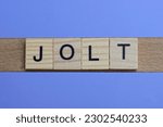 Small photo of word jolt made from wooden gray letters lies on a blue background