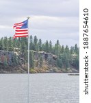 Small photo of The American Flag flying over Williams Lake in Eastern Washington. Cheney, Spokane County, Washington