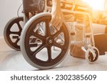Small photo of wheelchair is medical device for people who have had an accident or have problems walking to facilitate the patient. concept of preparing wheelchair for patients who are unable to help themselves.