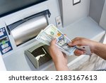 Small photo of Atm cash machine money. Woman withdraw money dollar bill. Holding american hundred cash. Money dollar, bank credit card