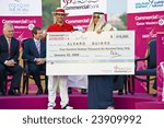 Small photo of DOHA QATAR - 25 JANUARY 2009: Champion Quiros receives his cheque for over $400k after winning the 2009 Commercial Bank Qatar Masters Tournament on 25 January in Doha, Qatar.