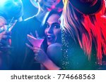 Small photo of Dance party with group people dancing. How to pick up girls at a club. Women and men have fun in night club. Seduce woman cuddles up guy . Opening of a new strip club.