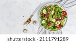 Small photo of Fresh salad with mussels, quail, egg, conjugate, lime, spinach, lettuce, cherry tomatoes and microgreen. Dietary salad. banner menu recipe place for text, top view.