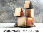 Small photo of spanish manchego aged cheeses on rustic wooden table. banner, menu, recipe place for text.