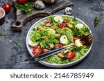 Small photo of Fresh salad with mussels, quail, egg, conjugate, lime, spinach, lettuce, cherry tomatoes and microgreen. Dietary salad. banner, menu, recipe place for text, top view