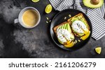 Small photo of Sandwiches with avocado and poached egg. Healthy food, keto diet, diet lunch concept. Top view.