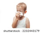 a little boy wipes his nose with a wet napkin on white background, Hygiene wet wipes carefully,